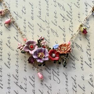 Les Nerides Floral Statement Necklace with Pink and Purple Accents